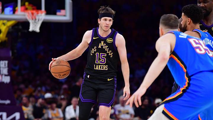 May 11, 2026; Los Angeles, California, USA; Los Angeles Lakers guard Austin Reaves (15) moves the ball against Oklahoma City Thunder center Isaiah Hartenstein (55) during the first half in game four of the second round of the 2026 NBA Playoffs at Crypto.com Arena. Mandatory Credit: Gary A. Vasquez-Imagn Images