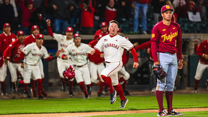 Nebraska second baseman Rhett Stokes scores on a game-winning bunt in the bottom of the 10th against No. 12 USC.