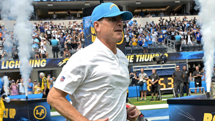 Sep 8, 2024; Inglewood, California, USA; Los Angeles Chargers head coach Jim Harbaugh leads the team on to the field for the game against the Las Vegas Raiders at SoFi Stadium. Mandatory Credit: Jayne Kamin-Oncea-Imagn Images