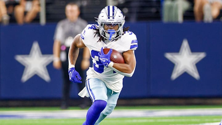 Aug 22, 2025; Arlington, Texas, USA; Dallas Cowboys running back Jaydon Blue (34) carries the ball during the fourth quarter against the Atlanta Falcons at AT&T Stadium.