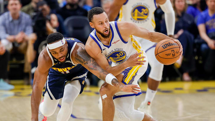 Golden State Warriors guard Stephen Curry (30) steals the ball from Denver Nuggets guard BruceBrown (11) during the second quarter at Chase Center.