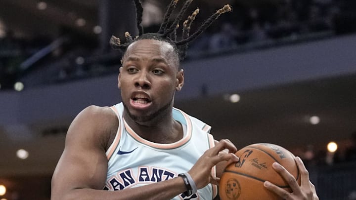 Jan 8, 2025; Milwaukee, Wisconsin, USA; San Antonio Spurs center Charles Bassey (28) grabs a rebound during the third quarter against the Milwaukee Bucks at Fiserv Forum. Mandatory Credit: Jeff Hanisch-Imagn Images Jan 8, 2025; Milwaukee, Wisconsin, USA; San Antonio Spurs center Charles Bassey (28) grabs a rebound during the third quarter against the Milwaukee Bucks at Fiserv Forum. Mandatory Credit: Jeff Hanisch-Imagn Images