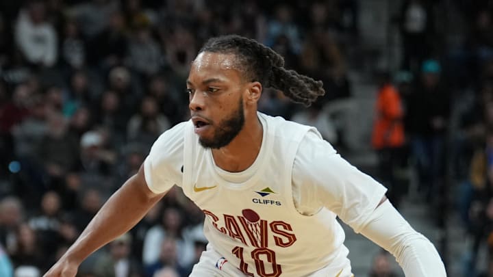 Cleveland Cavaliers guard Darius Garland dribbles against San Antonio Spurs guard Devin Vassell.