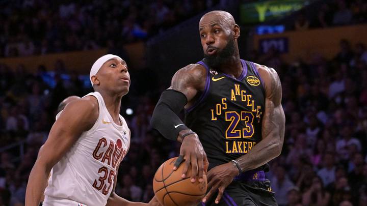 Mar 31, 2026; Los Angeles, California, USA;  Los Angeles Lakers forward LeBron James (23) passes behind Cleveland Cavaliers forward Nae'qwan Tomlin (35) in the first half at Crypto.com Arena. Mandatory Credit: Jayne Kamin-Oncea-Imagn Images
