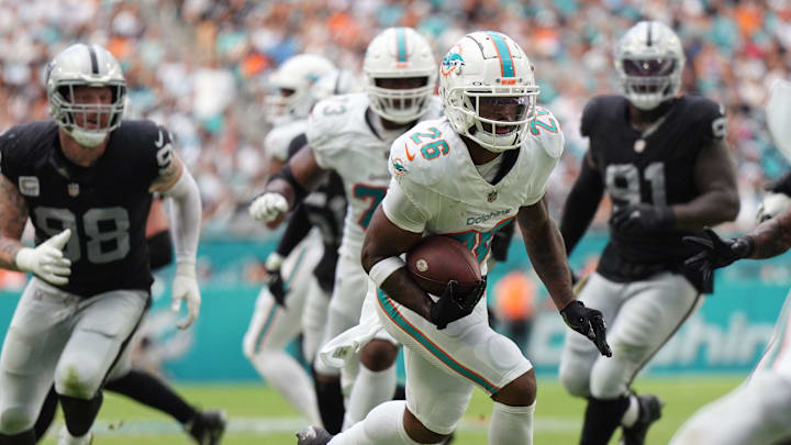 Miami Dolphins running back Salvon Ahmed (26) breaks free for a touchdown during the first half of an NFL game against the Las Vegas Raiders at Hard Rock Stadium in Miami Gardens, Nov. 19, 2023.