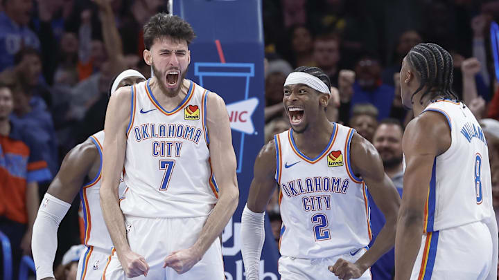 Dec 8, 2023; Oklahoma City, Oklahoma, USA; Oklahoma City Thunder forward Chet Holmgren (7), and guard Shai Gilgeous-Alexander (2) celebrate after Chet Holmgren scores a basket against the Golden State Warriors during the second half at Paycom Center. Mandatory Credit: Alonzo Adams-Imagn Images