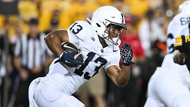 Oct 18, 2025; Iowa City, Iowa, USA; Penn State Nittany Lions running back Kaytron Allen (13) runs the ball against the Iowa Hawkeyes during the second quarter at Kinnick Stadium. Mandatory Credit: Jeffrey Becker-Imagn Images