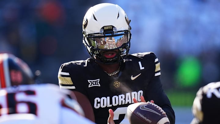 Nov 29, 2024; Boulder, Colorado, USA; Colorado Buffaloes quarterback Shedeur Sanders (2) takes a hike in the first quarter against the Oklahoma State Cowboys at Folsom Field. Mandatory Credit: Ron Chenoy-Imagn Images
