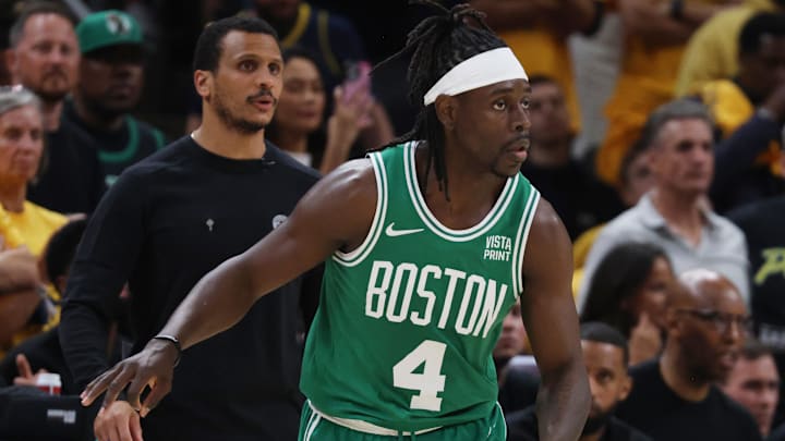 Boston Celtics guard Jrue Holiday (4) reacts in front of head coach Joe Mazzulla during the second quarter of a game at Gainbridge Fieldhouse.
