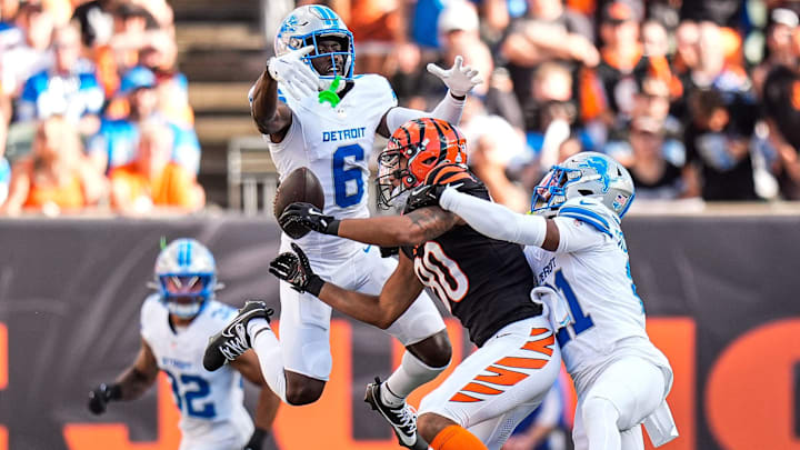 Detroit Lions cornerback Terrion Arnold (6), left, and cornerback Amik Robertson (21) break a pass intended for Cincinnati Bengals wide receiver Andrei Iosivas (80) during the first half at Paycor Stadium in Cincinnati on Sunday, Oct. 5, 2025.