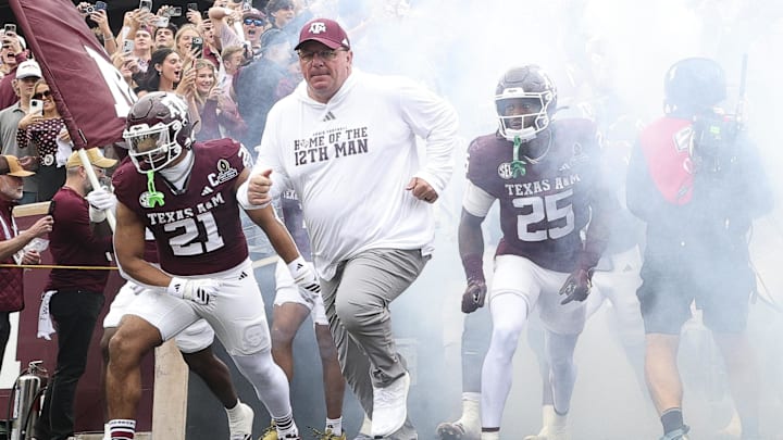 Texas A&M Aggies head coach Mike Elko takes the field prior to the game against the Miami Hurricanes during the first round of the CFP National Playoff at Kyle Field. 