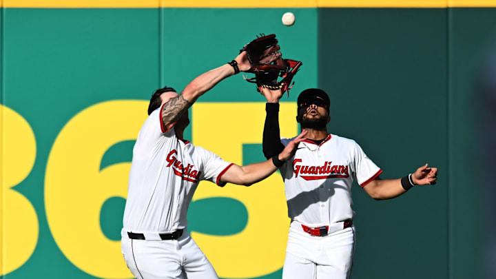 Oct 2, 2025; Cleveland, Ohio, USA; Cleveland Guardians outfielder Chase DeLauter (34) makes a catch in front of outfielder George Valera (35) in the sixth inning against the Detroit Tigers during game three of the Wildcard round for the 2025 MLB playoffs at Progressive Field. Mandatory Credit: Ken Blaze-Imagn Images