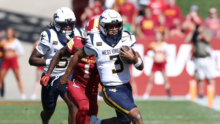 Oct 3, 2026; Ames, Iowa, USA;  Iowa State Cyclones cornerback Keyon Washington (1) chases West Virginia Mountaineers quarterback Michael Hawkins Jr. (3) at Jack Trice Stadium. 