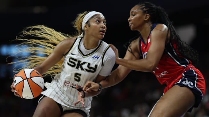Jul 29, 2025; Washington, District of Columbia, USA; Chicago Sky forward Angel Reese (5) drives to the basket as Washington Mystics forward Kiki Iriafen (44) defends in the first half at CareFirst Arena. Mandatory Credit: Geoff Burke-Imagn Images