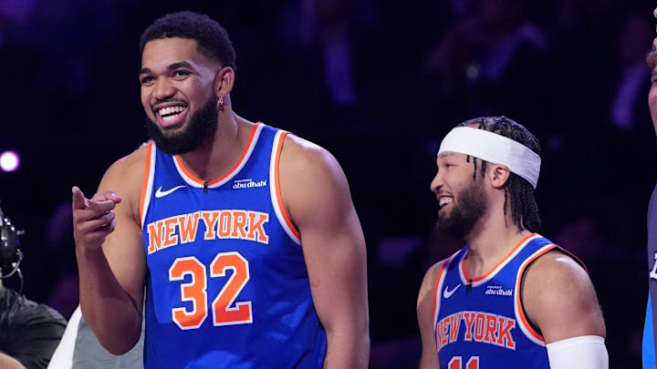 Feb 14, 2026; Los Angeles, CA, USA; New York Knicks center Karl-Anthony Towns (32) and guard Jalen Brunson (11) react during the shooting stars competition during the 2026 NBA All Star Saturday Night at Intuit Dome. Mandatory Credit: Kirby Lee-Imagn Images