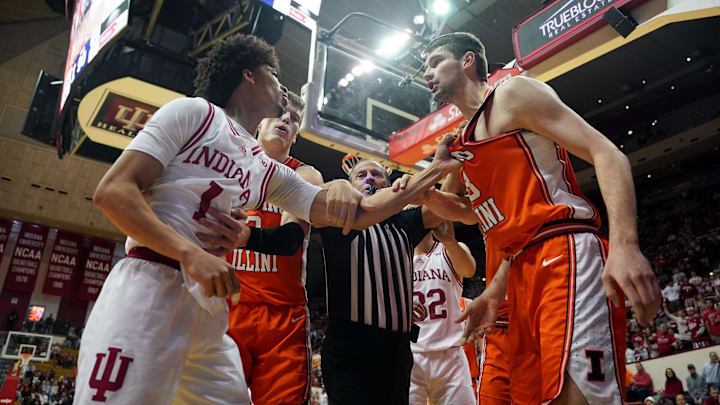 Jan 14, 2025; Bloomington, Indiana, USA; Indiana Hoosiers guard Myles Rice (1) and Illinois Fighting Illini center Tomislav Ivisic (13) fight during the second half at Simon Skjodt Assembly Hall. Mandatory Credit: Robert Goddin-Imagn Images Jan 14, 2025; Bloomington, Indiana, USA; Indiana Hoosiers guard Myles Rice (1) and Illinois Fighting Illini center Tomislav Ivisic (13) fight during the second half at Simon Skjodt Assembly Hall. Mandatory Credit: Robert Goddin-Imagn Images