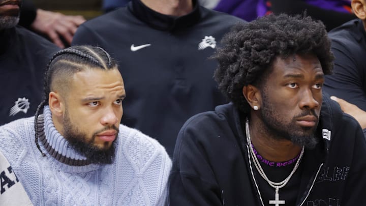 Mar 17, 2026; Minneapolis, Minnesota, USA; Phoenix Suns guard Jalen Green (4) and center Mark Williams (15) watch as their team plays the Minnesota Timberwolves in the fourth quarter at Target Center. Mandatory Credit: Bruce Kluckhohn-Imagn Images