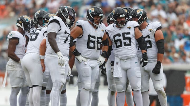 Sep 15, 2024; Jacksonville, Florida, USA; Jacksonville Jaguars offensive line Anton Harrison (77), offensive line Brandon Scherff (68), and offensive line Mitch Morse (65) wait to line up for the drive against the Cleveland Browns during the third quarter at EverBank Stadium. Mandatory Credit: Morgan Tencza-Imagn Images Sep 15, 2024; Jacksonville, Florida, USA; Jacksonville Jaguars offensive line Anton Harrison (77), offensive line Brandon Scherff (68), and offensive line Mitch Morse (65) wait to line up for the drive against the Cleveland Browns during the third quarter at EverBank Stadium. Mandatory Credit: Morgan Tencza-Imagn Images