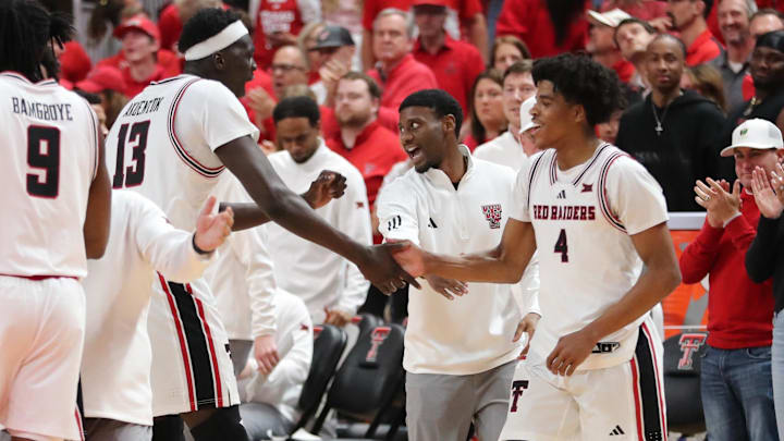 Texas Tech Red Raiders guard Christian Anderson (4) and forward Marial Akuentok (13) react at the end of the game against the Kansas State Wildcats at United Supermarkets Arena.