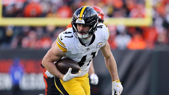 Dec 1, 2024; Cincinnati, Ohio, USA; Pittsburgh Steelers linebacker Payton Wilson (41) picks up the fumble en route to scoring a defensive touchdown during the fourth quarter against the Cincinnati Bengals at Paycor Stadium. Mandatory Credit: Joseph Maiorana-Imagn Images