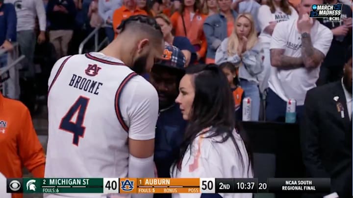 Johni Broome and his mother Julie speak on the court after he suffered an injury vs. Michigan State. 