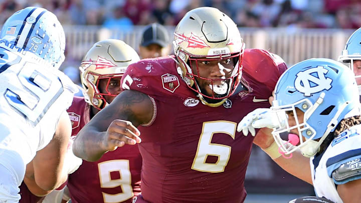 Nov 2, 2024; Tallahassee, Florida, USA; Florida State Seminoles defensive tackle Darrell Jackson Jr (6) pursues North Carolina Tarheels running back Davion Gause (21) in the second quarter at Doak S. Campbell Stadium. Mandatory Credit: Robert Myers-Imagn Images Nov 2, 2024; Tallahassee, Florida, USA; Florida State Seminoles defensive tackle Darrell Jackson Jr (6) pursues North Carolina Tarheels running back Davion Gause (21) in the second quarter at Doak S. Campbell Stadium. Mandatory Credit: Robert Myers-Imagn Images