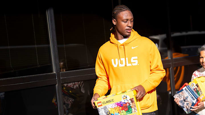 Incoming five-star quarterback Faizon Brandon, left, helps unload toys to give to young patients at East Tennessee Children's Hospital in Knoxville on Dec. 19, 2025. Incoming five-star quarterback Faizon Brandon, left, helps unload toys to give to young patients at East Tennessee Children's Hospital in Knoxville on Dec. 19, 2025.