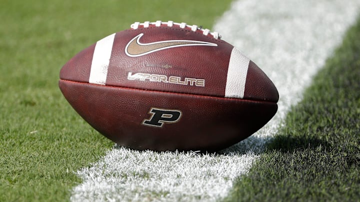 A football sits on the goal line