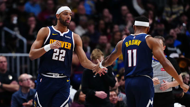 Jan 9, 2026; Denver, Colorado, USA; Denver Nuggets forward Zeke Nnaji (22) and  guard Bruce Brown (11) react in the second half against the Atlanta Hawks at Ball Arena. Mandatory Credit: Ron Chenoy-Imagn Images