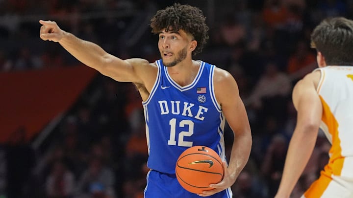 Duke forward Cameron Boozer (12) sends out instructions while guarded by Tennessee forward J.P. Estrella (13) during a college basketball exhibition game between on October 26, 2025, in Knoxville, Tenn.