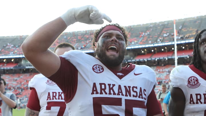 Sep 21, 2024; Auburn, Alabama, USA;  Arkansas Razorbacks offensive lineman Fernando Carmona (55) celebrates with fans after the Razorbacks beat the Auburn Tigers at Jordan-Hare Stadium. Mandatory Credit: John Reed-Imagn Images