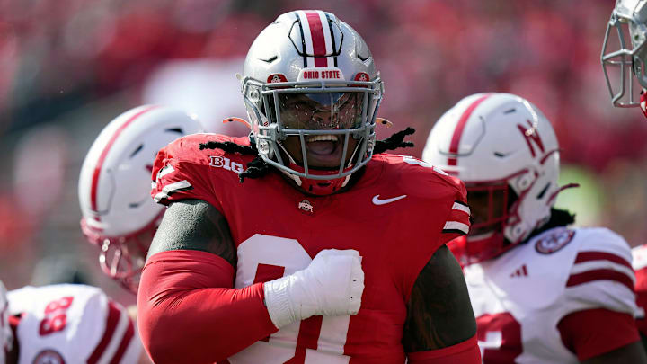Ohio State Buckeyes defensive tackle Tyleik Williams (91) celebrates the tackle of Nebraska Cornhuskers quarterback Dylan Raiola (15) on a run during the first quarter of their game at Ohio Stadium on Oct 26, 2024, in Columbus.