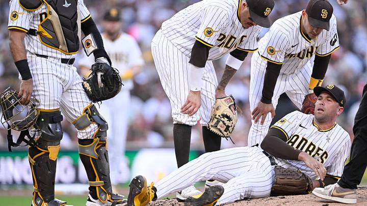 San Diego Padres relief pitcher Jason Adam (40) lies on the ground during the seventh inning against the Baltimore Orioles at Petco Park on Sept. 1, 2025. San Diego Padres relief pitcher Jason Adam (40) lies on the ground during the seventh inning against the Baltimore Orioles at Petco Park on Sept. 1, 2025.