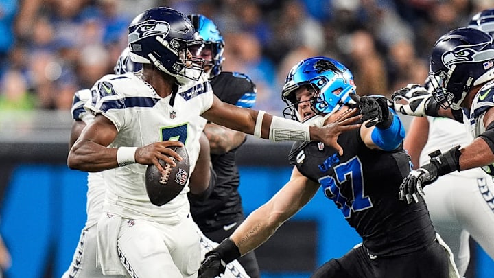 Detroit Lions defensive end Aidan Hutchinson (97) pressures Seattle Seahawks quarterback Geno Smith (7) during the second half at Ford Field in Detroit on Monday, Sept. 30, 2024. Detroit Lions defensive end Aidan Hutchinson (97) pressures Seattle Seahawks quarterback Geno Smith (7) during the second half at Ford Field in Detroit on Monday, Sept. 30, 2024.
