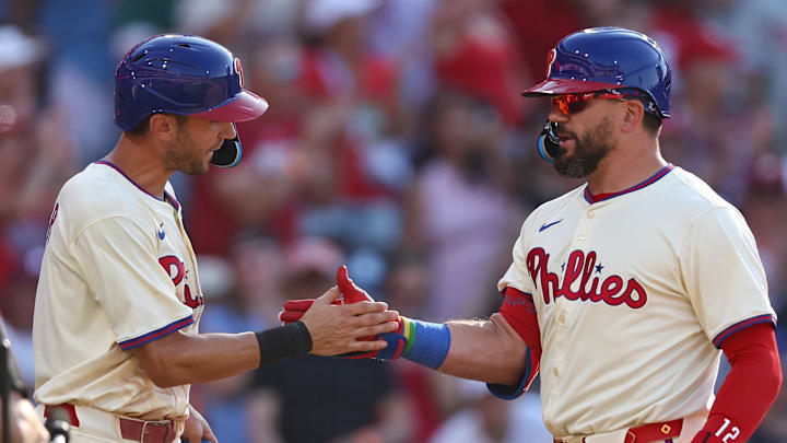 Jul 5, 2025; Philadelphia, Pennsylvania, USA; Philadelphia Phillies outfielder Kyle Schwarber (12) shakes hands with shortstop Trea Turner (7) after hitting a two RBI home run during the eighth inning against the Cincinnati Reds at Citizens Bank Park.