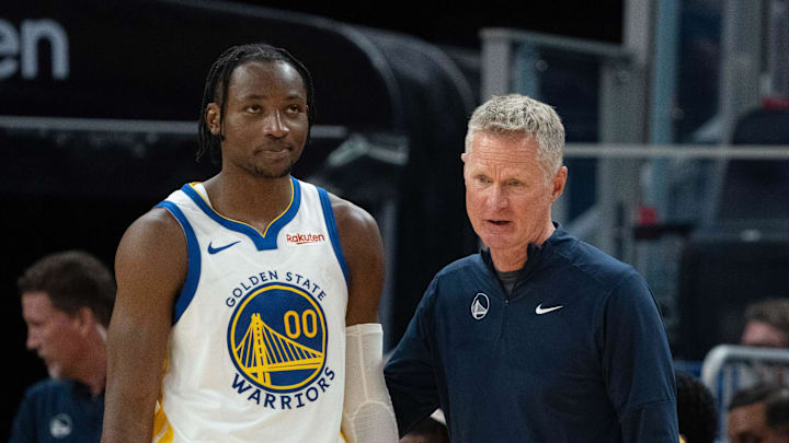 October 20, 2023; San Francisco, California, USA; Golden State Warriors head coach Steve Kerr (right) talks to forward Jonathan Kuminga (00) during the third quarter against the San Antonio Spurs at Chase Center. Mandatory Credit: Kyle Terada-Imagn Images