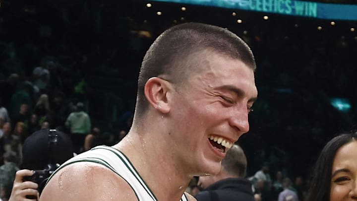 Mar 5, 2025; Boston, Massachusetts, USA; After scoring a career high 43 points, Boston Celtics guard Payton Pritchard (11) has a laugh with center Al Horford (42) after their win over the Portland Trail Blazers at TD Garden. Mandatory Credit: Winslow Townson-Imagn Images