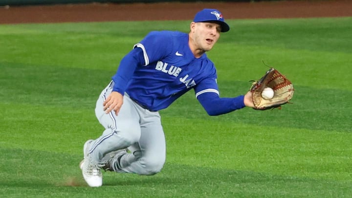 May 27, 2025; Arlington, Texas, USA; Toronto Blue Jays center fielder Daulton Varsho (5) makes a diving catch during the third inning against the Texas Rangers at Globe Life Field. May 27, 2025; Arlington, Texas, USA; Toronto Blue Jays center fielder Daulton Varsho (5) makes a diving catch during the third inning against the Texas Rangers at Globe Life Field.