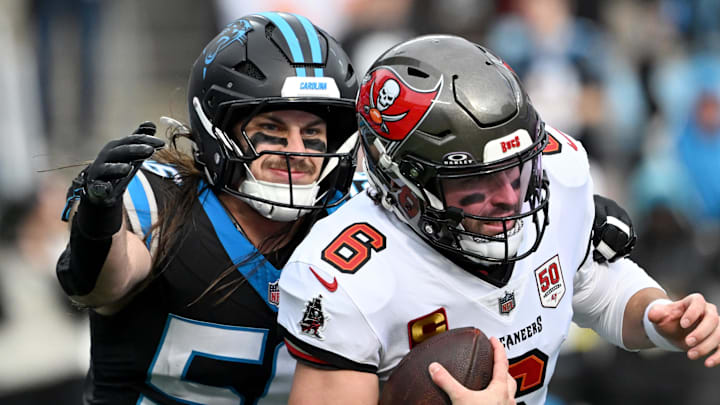Dec 21, 2025; Charlotte, North Carolina, USA; Carolina Panthers linebacker Christian Rozeboom (56) sacks Tampa Bay Buccaneers quarterback Baker Mayfield (6) during the first half at Bank of America Stadium. Mandatory Credit: Bob Donnan-Imagn Images