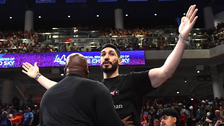 Aug 23, 2026; Chicago, Illinois, USA;  Turkish-American former basketball player and human rights activist Enes Kanter Freedom reacts as he is removed from the arena during the second half against the Indiana Fever at Wintrust Arena.  Mandatory Credit: Patrick Gorski-Imagn Images