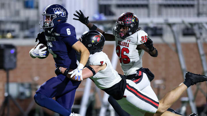 Prosper Walnut Grove's Jack Jones is tackled by a Melissa defender in a game last week.