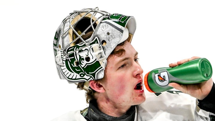 Michigan State's Trey Augustine takes a water break during a break in the action against Minnesota in the first period on Saturday, Jan. 25, 2025, at Munn Arena in East Lansing.