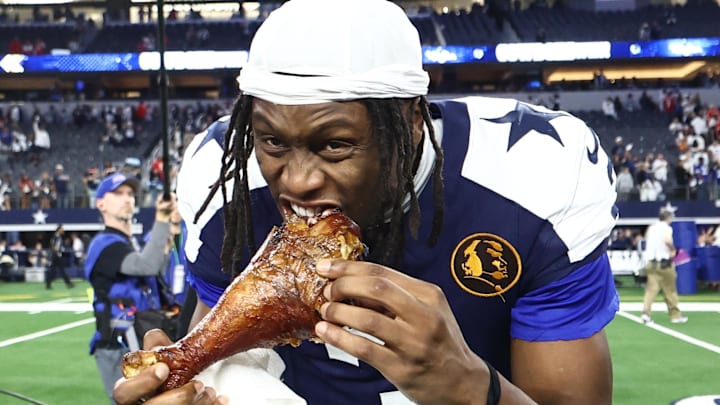 Nov 27, 2025; Arlington, Texas, USA; Dallas Cowboys wide receiver George Pickens (3) celebrates by eating turkey after the game against the Kansas City Chiefs at AT&T Stadium. Mandatory Credit: Kevin Jairaj-Imagn Images