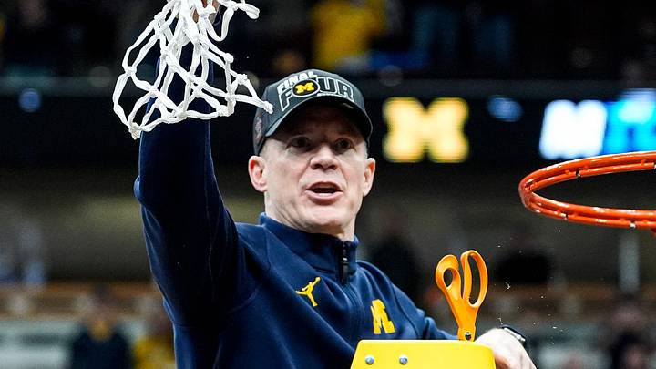Michigan coach Dusty May celebrates after winning the NCAA Tournament Midwest Regional final by defeating Tennessee 95-62 at United Center in Chicago on Sunday, March 29, 2026. Michigan coach Dusty May celebrates after winning the NCAA Tournament Midwest Regional final by defeating Tennessee 95-62 at United Center in Chicago on Sunday, March 29, 2026.