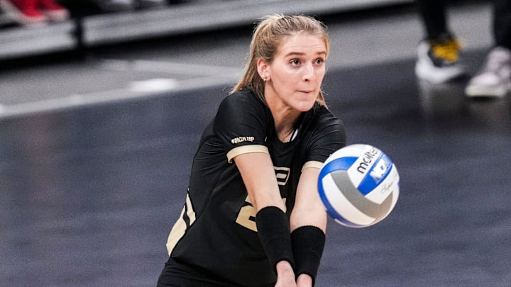 Purdue Boilermakers defensive specialist Julia Kane (21) passes the ball Purdue Boilermakers defensive specialist Julia Kane (21) passes the ball