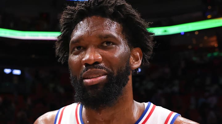 Mar 30, 2026; Miami, Florida, USA; Philadelphia 76ers center Joel Embiid (21) speaks to Miami Heat forward Andrew Wiggins (22) after the game at Kaseya Center. Mandatory Credit: Sam Navarro-Imagn Images
