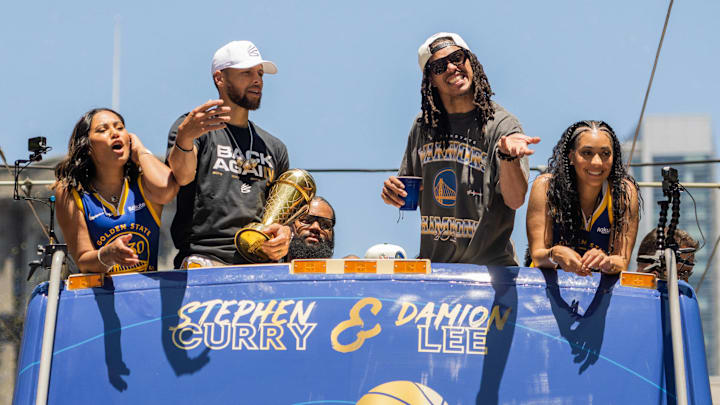Ayesha Curry, Steph Curry, Damion Lee and Sydel Curry celebrate on a float during the Golden State Warriors Championship Parade.