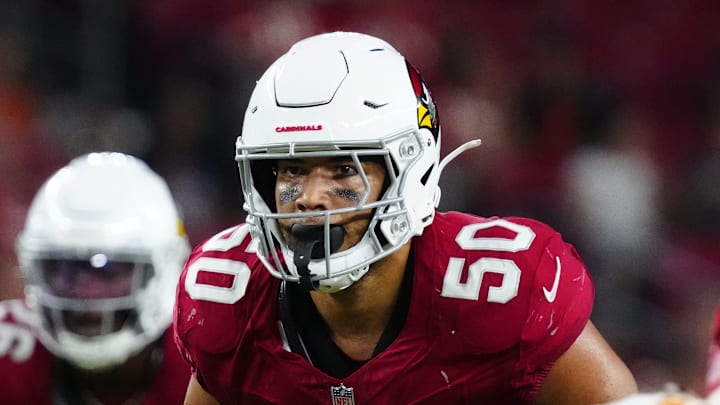 Cardinals linebacker Cody Simon (50) looks at the Chiefs quarterback Chris Oladokun (19) as he snaps the ball during a preseason game at State Farm Stadium on Aug. 9, 2025, in Glendale.