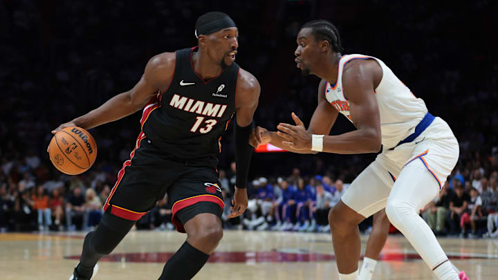 Oct 26, 2025; Miami, Florida, USA; Miami Heat center Bam Adebayo (13) drives to the basket against New York Knicks center Ariel Hukporti (55) during the first quarter at Kaseya Center. Mandatory Credit: Sam Navarro-Imagn Images