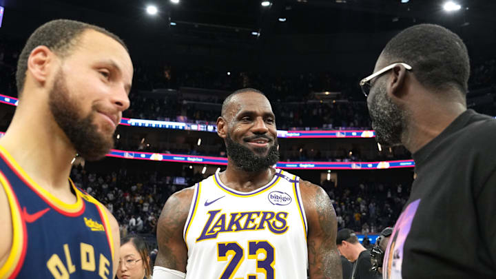 Jan 25, 2025; San Francisco, California, USA; Los Angeles Lakers forward LeBron James (23) talks with Golden State Warriors guard Stephen Curry (30) and forward Draymond Green (right) after the game at Chase Center. Mandatory Credit: Darren Yamashita-Imagn Images
